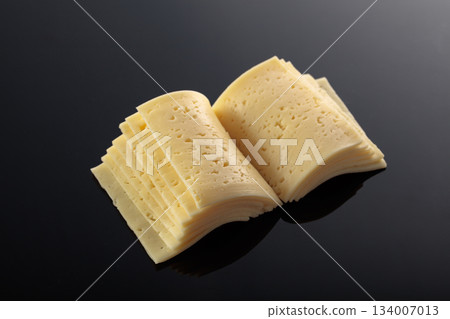 Cheese slices folded like an open book. Cheese slices folded like an open book. 134007013
