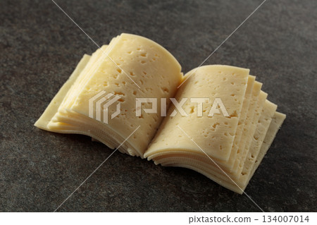 Cheese slices folded like an open book. Cheese slices folded like an open book. 134007014