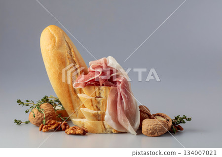 Prosciutto with baguette, walnuts, and thyme. 134007021