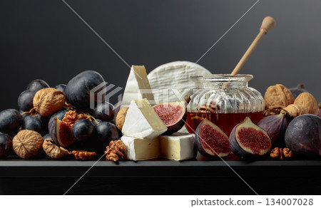 Soft cheese with fruits on a black background. Soft cheese with fruits on a black background. 134007028