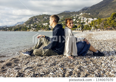 young caucasian couple tourists having fun on sea side, lifestyle people concept young caucasian couple tourists having fun on sea side, lifestyle people concept 134007070