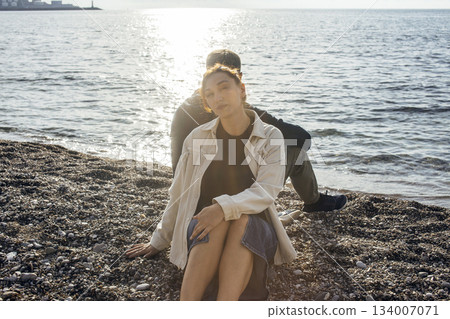 young caucasian couple tourists having fun on sea side, lifestyle people concept young caucasian couple tourists having fun on sea side, lifestyle people concept 134007071