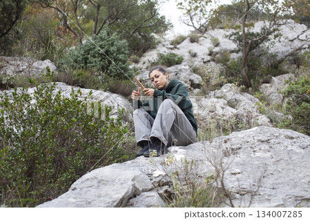 young pretty brunette girl hiking to waterfall, lifestyle people concept young pretty brunette girl hiking to waterfall, lifestyle people concept 134007285