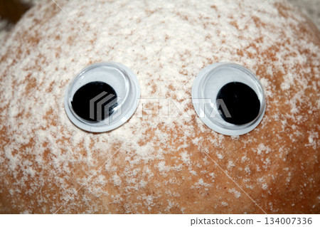 A Funny Freshly Home Made Baked Bread Roll With Googly Wobble Eyes A Funny Freshly Home Made Baked Bread Roll With Googly Wobble Eyes 134007336