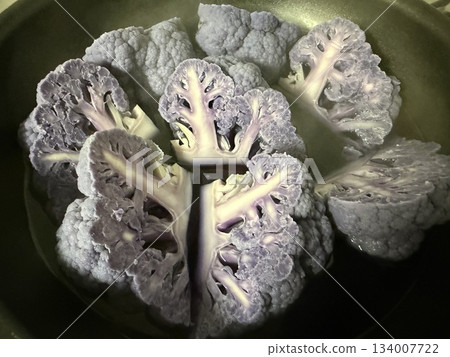1 medium-sized purple cauliflower, cut into eighths, boiled in a frying pan 1 medium-sized purple cauliflower, cut into eighths, boiled in a frying pan 134007722