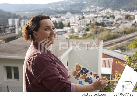 mature woman outside painting picture, lifestyle people concept 134007783