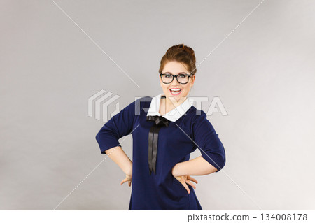 Happy positive business woman, accountant or teacher 134008178
