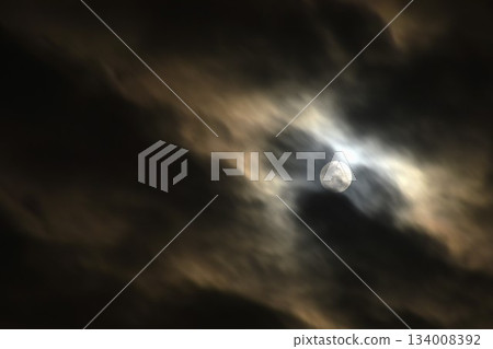 full moon covering by cloud floating on sky in night background full moon covering by cloud floating on sky in night background 134008392