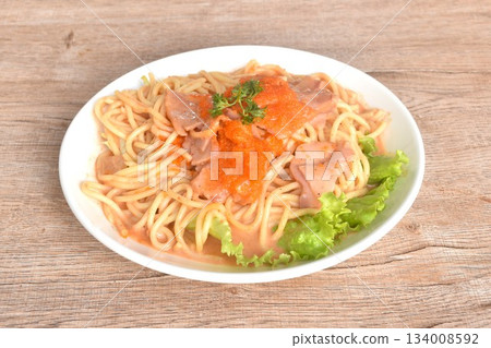 spicy stir fried spaghetti with slice ham pork dressing Rose Korean sauce topping shrimp egg on plate  134008592