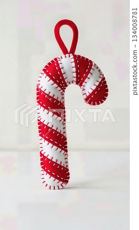 Whimsical Felt Candy Cane Ornament Red White Striped Hand Stitched Isolated Playful Christmas Decoration 134008781