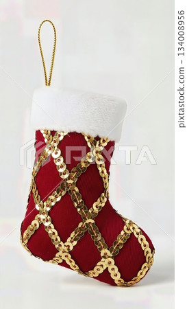 Sophisticated Gold Sequin Embellished Christmas Stocking Decoration Luxury Fabric Isolated Professional Product Photography Sophisticated Gold Sequin Embellished Christmas Stocking Decoration Luxury Fabric Isolated Professional Product Photography 134008956