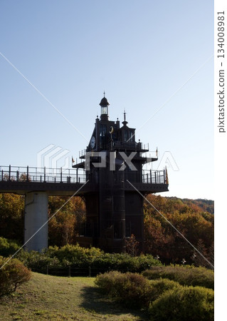 Ghibli Park in autumn: The elevator tower surrounded by autumn leaves (morning light) Ghibli Park in autumn: The elevator tower surrounded by autumn leaves (morning light) 134008981