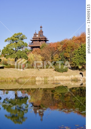 Ghibli Park's elevator tower reflected on the water surface Autumn scenery with autumn leaves Ghibli Park's elevator tower reflected on the water surface Autumn scenery with autumn leaves 134009115
