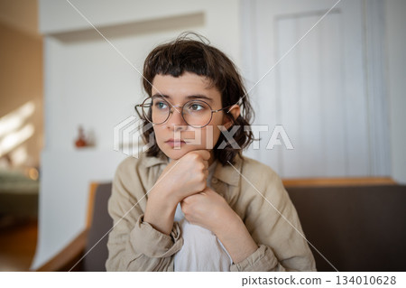Melancholic calm teenager having no motivation, interest to life, feeling apathy and depression Melancholic calm teenager having no motivation, interest to life, feeling apathy and depression 134010628
