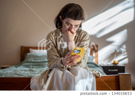Outcast teenage girl having social difficulties in communication spending time at home in solitude 134010653