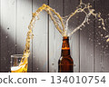 A scene of beer being poured into a glass A scene of beer being poured into a glass 134010754