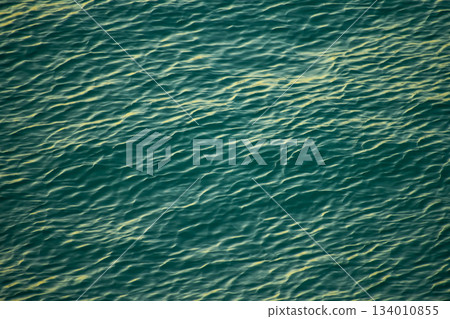Sea water surface, wave texture. Calm seascape. The background of the blue waters of the sea. Background sea calm water. 134010855