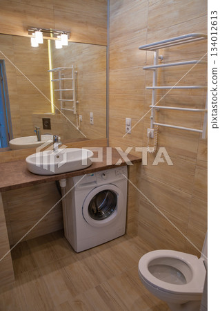 Modern bathroom interior with washing machine. Modern bathroom interior with washing machine. 134012613