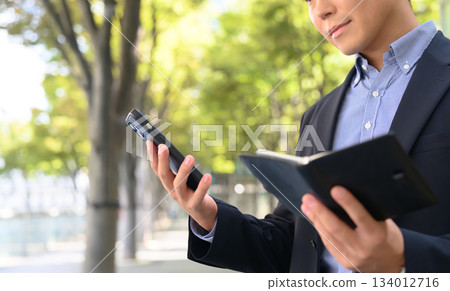 Male smartphone notebook Male smartphone notebook 134012716