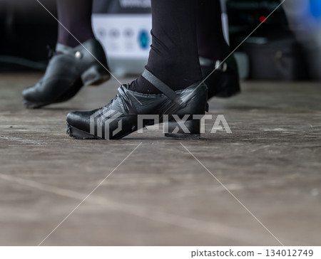 Young Irish Dance Lady in Jig Shoes performing on stage Young Irish Dance Lady in Jig Shoes performing on stage 134012749