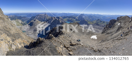 Hiking to Schesaplana in the Rtikon mountain range in Vorarlberg, Austria with views of the landscape and hikers Hiking to Schesaplana in the Rtikon mountain range in Vorarlberg, Austria with views of the landscape and hikers 134012765