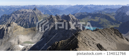 View from Schesaplana during hike in Ratikon mountain range in Vorarlberg, Austria with clear skies and distant peaks 134012766