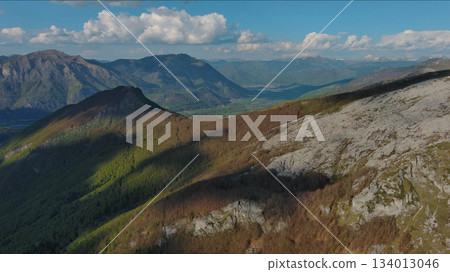 Rocky mountains and valley before sunset aerial 134013046