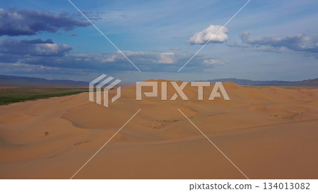 Aerial view of sand dunes in desert at sunset Aerial view of sand dunes in desert at sunset 134013082