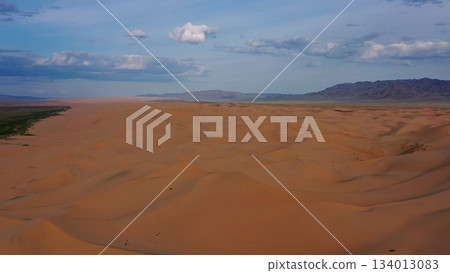 Aerial view of sand dunes in desert at sunset 134013083