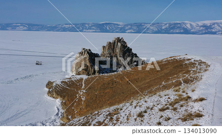 Shaman rock in frozen lake Baikal 134013090
