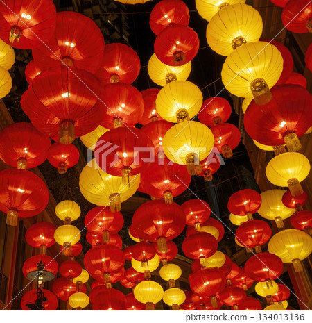 Colorful chinese lanterns illuminate evening street Colorful chinese lanterns illuminate evening street 134013136
