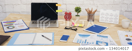 Banner Meeting room Office laptop business financial chart graph coffee cup in conference room. Panorama Flatlay office supply laptop desk. Business graph chart on meeting table with copy space Banner Meeting room Office laptop business financial chart graph coffee cup in conference room. Panorama Flatlay office supply laptop desk. Business graph chart on meeting table with copy space 134014017
