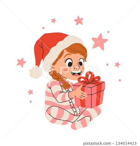 Vector illustration of cartoon happy little girl smiling, sitting in striped pajamas and red santa hat holding present with a bow for christmas. 134014423