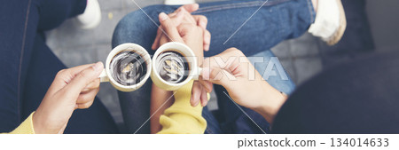 Banner Asian Business people smiling Relax holding cup of coffee in modern city. Couple lover enjoy drinking takeaway hot coffee together. Young Business people holding cup of coffee with copy space 134014633