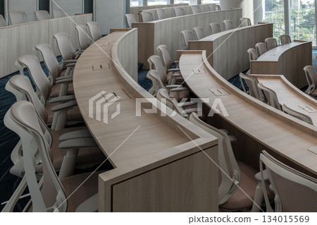 Characterized by its distinctly modern, minimalist design and semi-circular, tiered seating, this auditorium provides an ideal setting for focused presentations. Characterized by its distinctly modern, minimalist design and semi-circular, tiered seating, this auditorium provides an ideal setting for focused presentations. 134015569