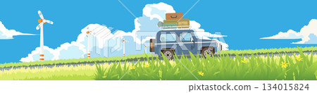 Landscape of touring car with luggage on roof rack with driver. Car drives up a hill surrounded by green grass and flowers in front. Windmill in the background suggesting a windy. Under blue sky. Landscape of touring car with luggage on roof rack with driver. Car drives up a hill surrounded by green grass and flowers in front. Windmill in the background suggesting a windy. Under blue sky. 134015824