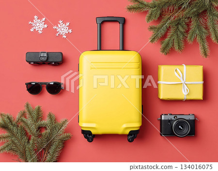Bright yellow suitcase and holiday items arranged on red background, showcasing travel essentials for festive season adventures Bright yellow suitcase and holiday items arranged on red background, showcasing travel essentials for festive season adventures 134016075