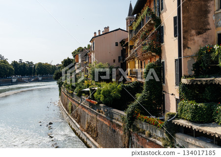 Verona cityscape with buildings along the Adige River on a sunny day. Verona cityscape with buildings along the Adige River on a sunny day. 134017185