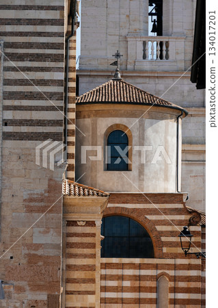 Architectural detail of the Verona Cathedral, showcasing its unique brickwork and design. 134017201