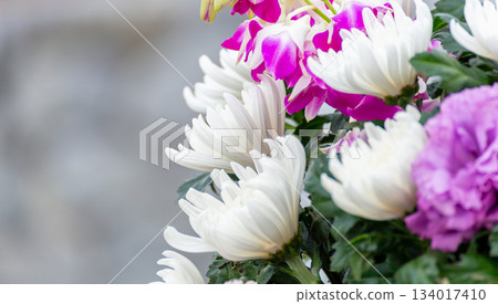 Bouquet of Buddhist flowers (white chrysanthemum, pink orchid) 134017410