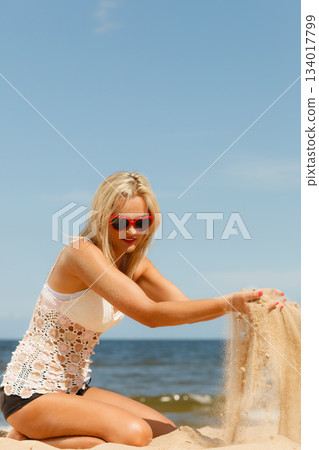 Pretty girl on beach. 134017799