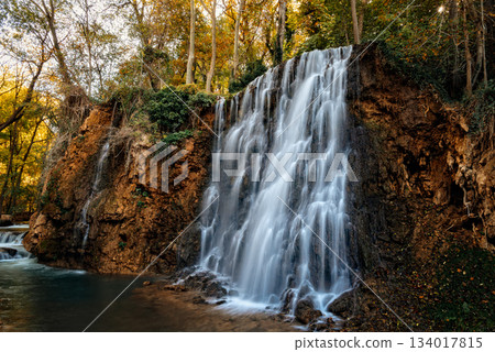 Scenic waterfall cascading down rocks in Monasterio de Piedra, Spain Scenic waterfall cascading down rocks in Monasterio de Piedra, Spain 134017815