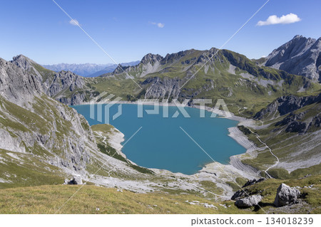 Lunersee artificial lake in Ratikon Alps shows stunning water color and mountain landscape in Vorarlberg Austria Lunersee artificial lake in Ratikon Alps shows stunning water color and mountain landscape in Vorarlberg Austria 134018239