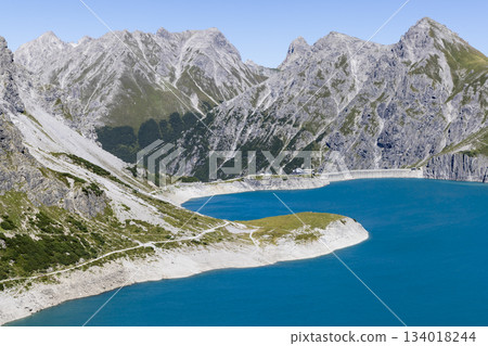 Explore Lunersee artificial lake in Ratikon Alps during sunny weather, capturing nature in Vorarlberg, Austria Explore Lunersee artificial lake in Ratikon Alps during sunny weather, capturing nature in Vorarlberg, Austria 134018244