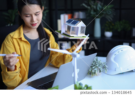 Beautiful engineer working in office design eco friendly and sustainable living home. 134018645