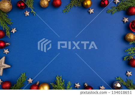 Christmas Frame with Red and Gold Ornaments on Blue Background 134018651