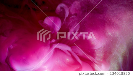 Underwater ink splash. Paint fog. Defocused pink color glitter vivid liquid sparkling cloud spreading on abstract smoke art background. 134018830