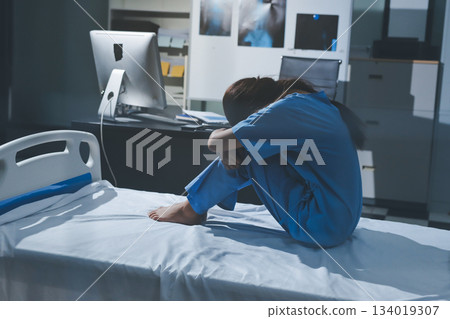 A patient with depression looks outside. A patient with depression looks outside. 134019307