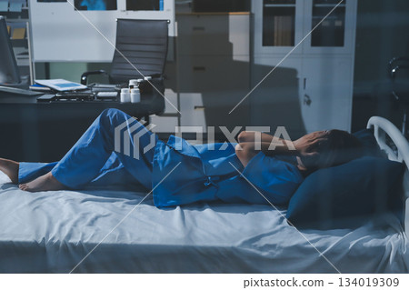 A patient with depression looks outside. A patient with depression looks outside. 134019309