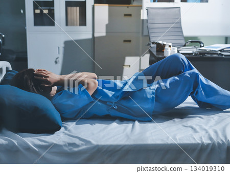 A patient with depression looks outside. A patient with depression looks outside. 134019310